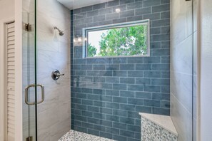 Shower, hair dryer, towels, shampoo
