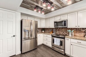 Fridge, microwave, stovetop, dishwasher - Spanish Wells Retreat | Pool & Spa | Sleeps 12 (Scottsdale)