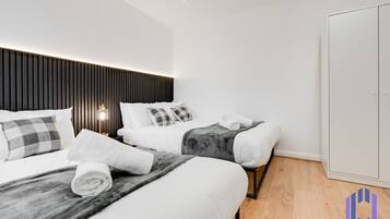 2 bedrooms, desk, iron/ironing board, travel crib