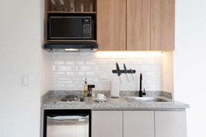 Fridge, microwave, stovetop, coffee/tea maker