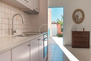 Fridge, oven, coffee/tea maker, cookware/dishes/utensils