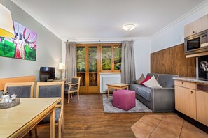 Télévision à écran plat de 100 cm avec chaînes par câble