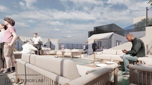 Area lounge sulla terrazza con posti a sedere all'aperto, un bar e vista sullo skyline della città.