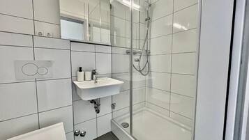 Double Room | Bathroom | Shower, hydromassage showerhead, hair dryer, towels