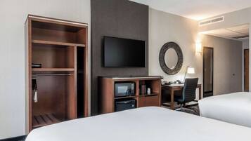 Desk, laptop workspace, iron/ironing board, free cribs/infant beds