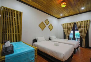 A hotel room with two beds, a wooden ceiling, and a window with curtains. - Kosy Villa (Luang Prabang)