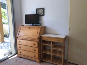 Enjoy a comfortable stay with a dresser, flat-screen TV, and convenient storage.