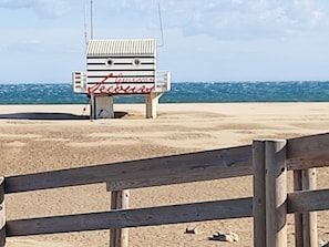 A beachside wooden structure with a sign that reads "Leisure".