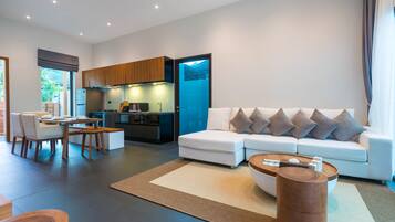 Premium Villa, Garden View | Living area | Smart TV