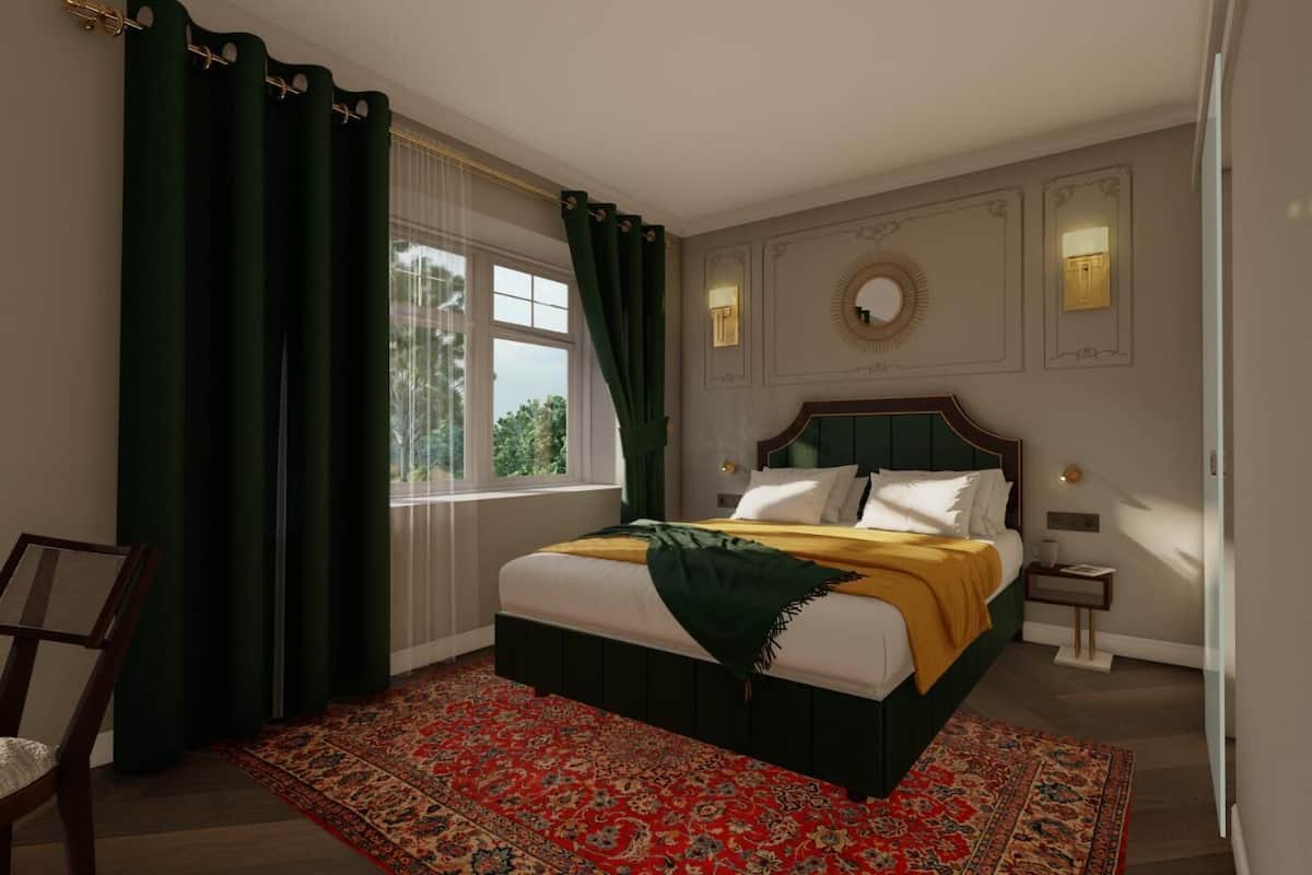 A bedroom with a bed, a chair, a nightstand, and a window with curtains.