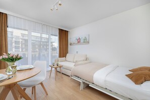 Studio, Balcony, River View | Desk, laptop workspace, cribs/infant beds, bed sheets