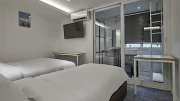 Premium bedding, memory-foam beds, desk, laptop workspace