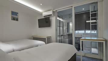 Habitación Deluxe con 1 cama matrimonial o 2 individuales, para no fumadores | Ropa de cama de alta calidad, camas con efecto memoria y escritorio