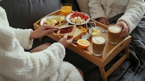 A breakfast tray with toast, eggs, fruit, and coffee on a wooden table. - Superb BnB with private Jacuzzi & Bathtub + Breakfast Included (Hvar)