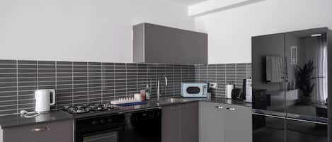 Exclusive Apartment | Private kitchen | Full-size fridge, microwave, oven, stovetop