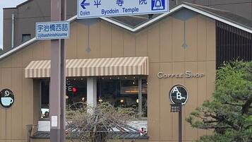 A signboard with directions to various locations including Yodo, Kumiyama, Otsu, and others.