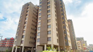 A high-rise residential building with multiple floors and balconies. - Lux Suites Clay City Heights Kasarani (Nairobi)