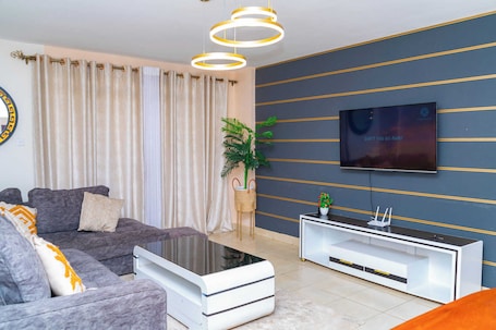 Business Apartment | Living area | 24-inch Smart TV with digital channels