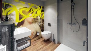 A modern bathroom with a shower, toilet, and vanity. - Mezzotel (Gladbeck)