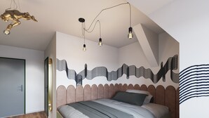 A bedroom with a bed, a unique wall art design, and a ceiling light fixture. - Mezzotel (Gladbeck)