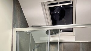 A glass-enclosed shower with a handheld showerhead and a handheld faucet. - Turn up. Switch off Surrounded by trees with stream nearby, perfect escape for 2 (Windermere)