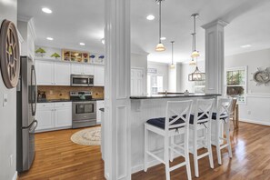 Fridge, microwave, oven, stovetop - Surf Song - Beautiful 5 bedroom / 5 bathroom house in Kure Beach (Kure Beach)