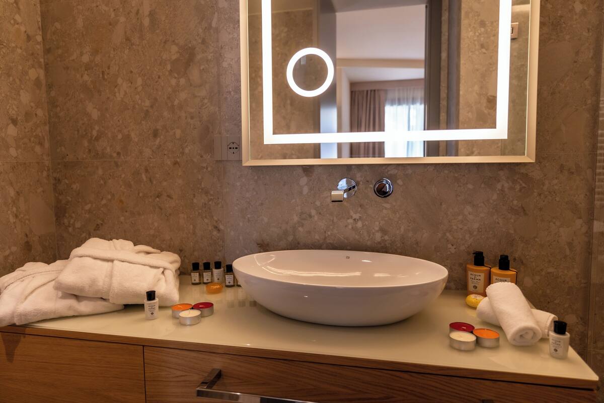 Bathroom | Shower, rainfall showerhead, hair dryer, bathrobes