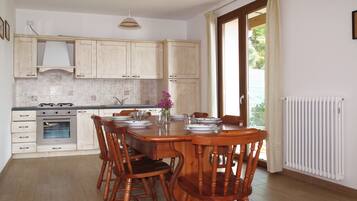 Fridge, stovetop, dishwasher, coffee/tea maker