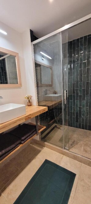 Shower, hair dryer, towels, soap