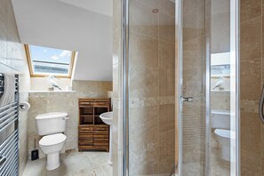 Shower, hair dryer, towels, toilet paper