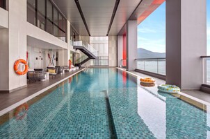 Outdoor pool, open 6:00 AM to 6:00 PM, pool loungers