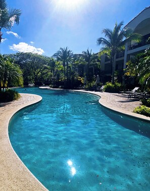 Outdoor pool - Spacious Pacifico condo-large balcony.  Access to pool, jacuzzi with bar/grill (Guanacaste Province)