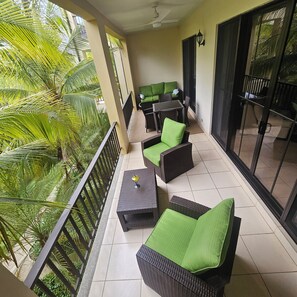 Terrace/patio - Spacious Pacifico condo-large balcony.  Access to pool, jacuzzi with bar/grill (Guanacaste Province)