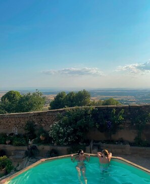 A swimming pool with a view of a landscape.