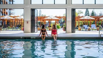 Indoor pool, outdoor pool, pool umbrellas, pool loungers