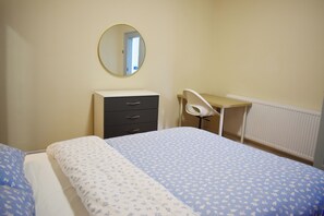 Desk, laptop workspace, blackout curtains, iron/ironing board