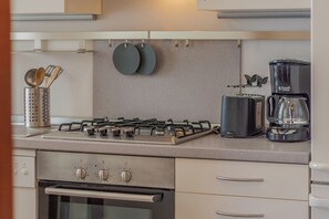 Apartment, Lake View | Private kitchenette | Espresso maker, electric kettle, highchair