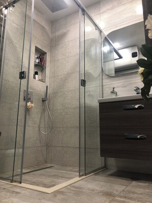 Shower, hair dryer, towels, soap