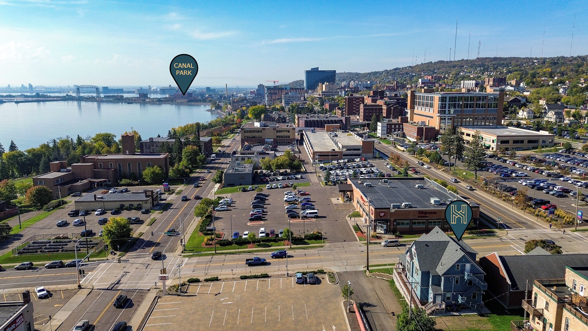 A parking lot with multiple rows of cars, a CVS store, and a Walgreens.
