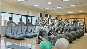 A gym with treadmills, elliptical machines, and exercise balls. - Hilton Hawaiian Village Lagoon Tower 2BR 2BA sleeps 6 (Honolulu)