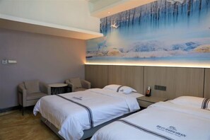 A hotel room with two beds, a small round table, and a chair. - Nandan Home Inn Paibaiyun Hotel (Nandan)