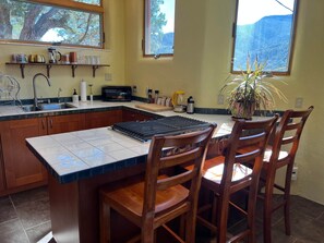 Fridge, microwave, stovetop, coffee/tea maker