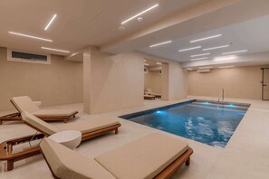Indoor pool, seasonal outdoor pool, pool umbrellas, pool loungers
