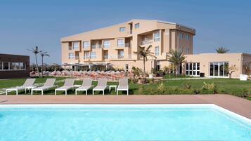 Indoor pool, seasonal outdoor pool, pool umbrellas, sun loungers