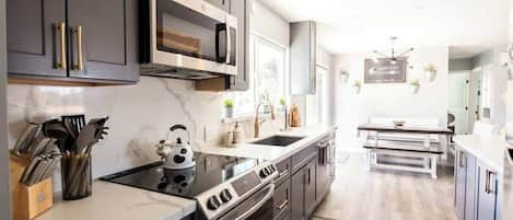 Coffee/tea maker, fridge, microwave, oven
