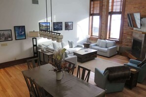 TV, fireplace, books - Historic Schoolhouse Gem, Spa, and Gym Access (Fernie)