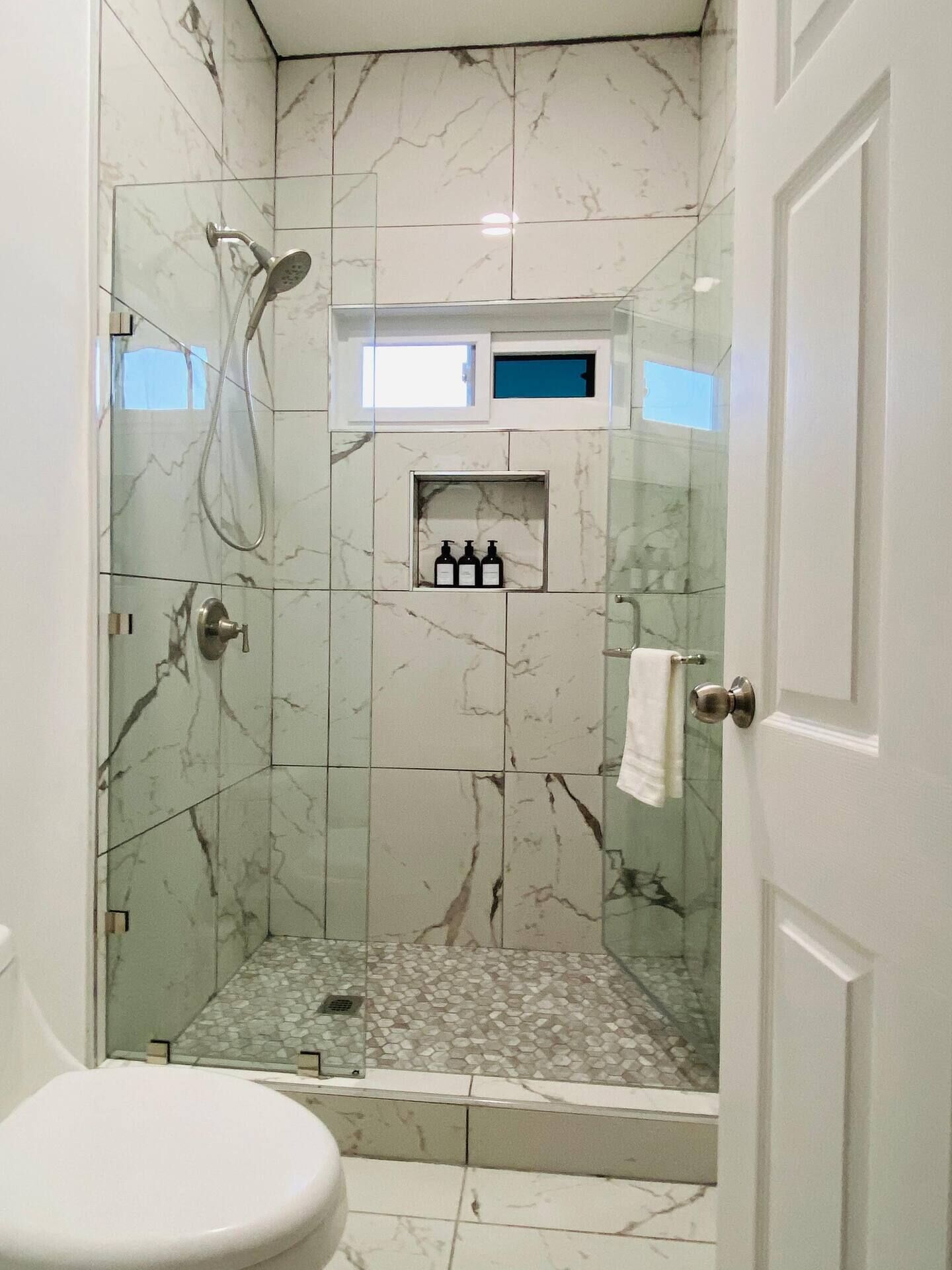 Shower, hair dryer, towels, soap