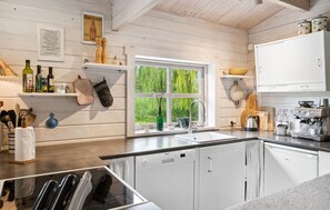 Fridge, stovetop, dishwasher, coffee/tea maker