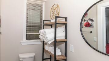 Shower, hair dryer, towels, soap