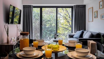 Appartement Signature, vue ville | Salle Ă manger